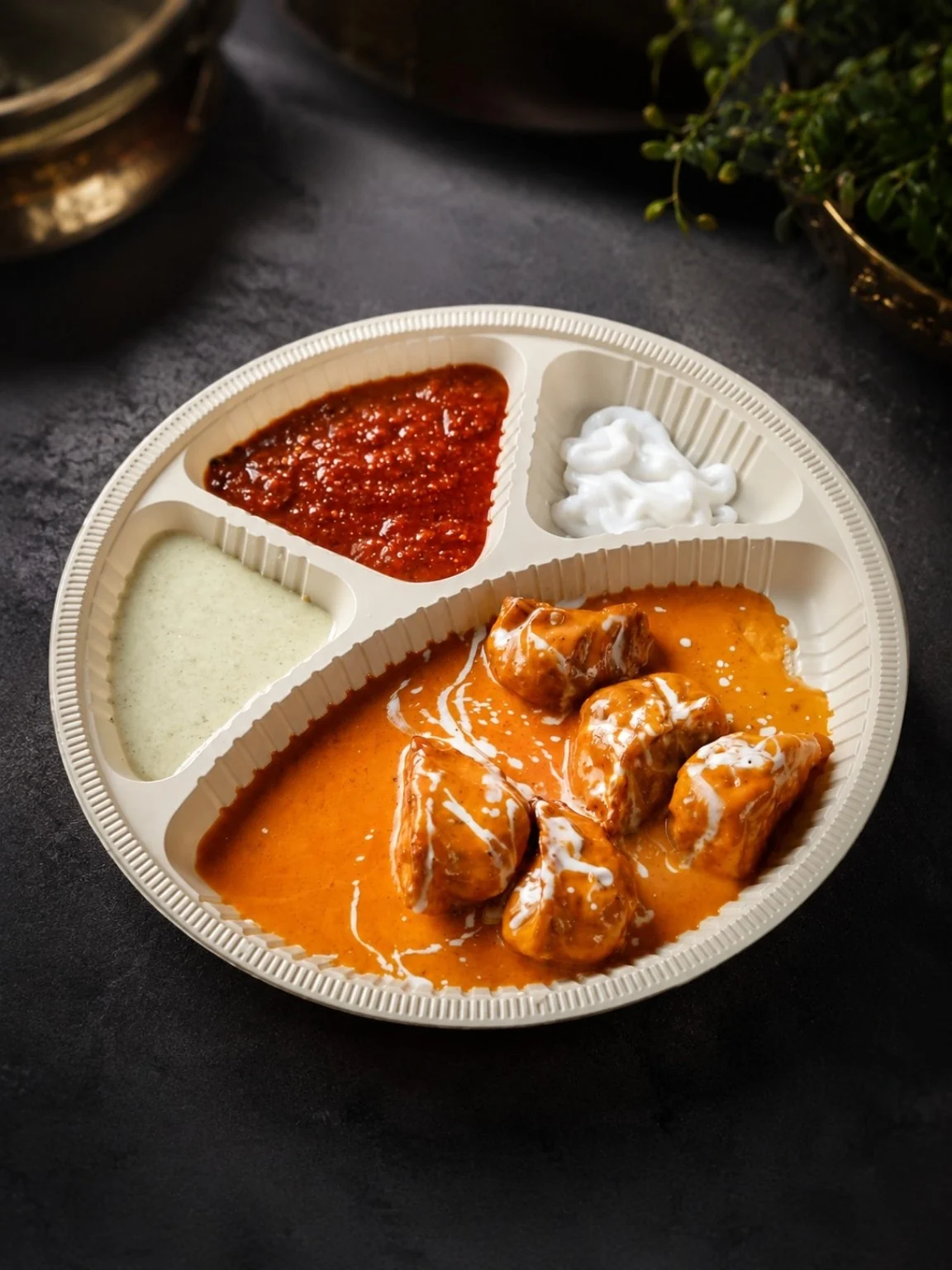 The Momolicious creamy gravy momos with chutneys